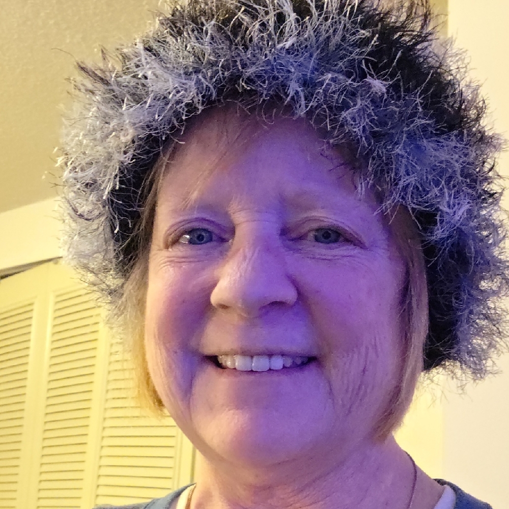 Fuzzy Green and White Hat with Gold Embellished Top.